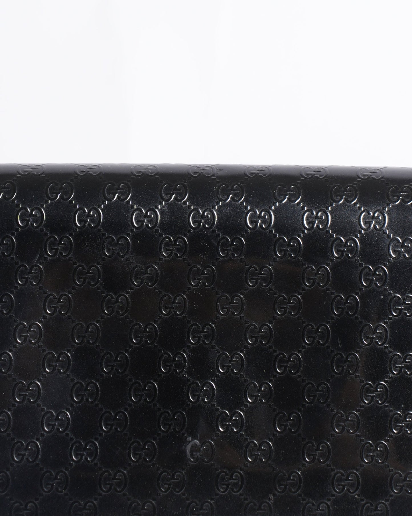 Gucci Monogram Leather Clutch