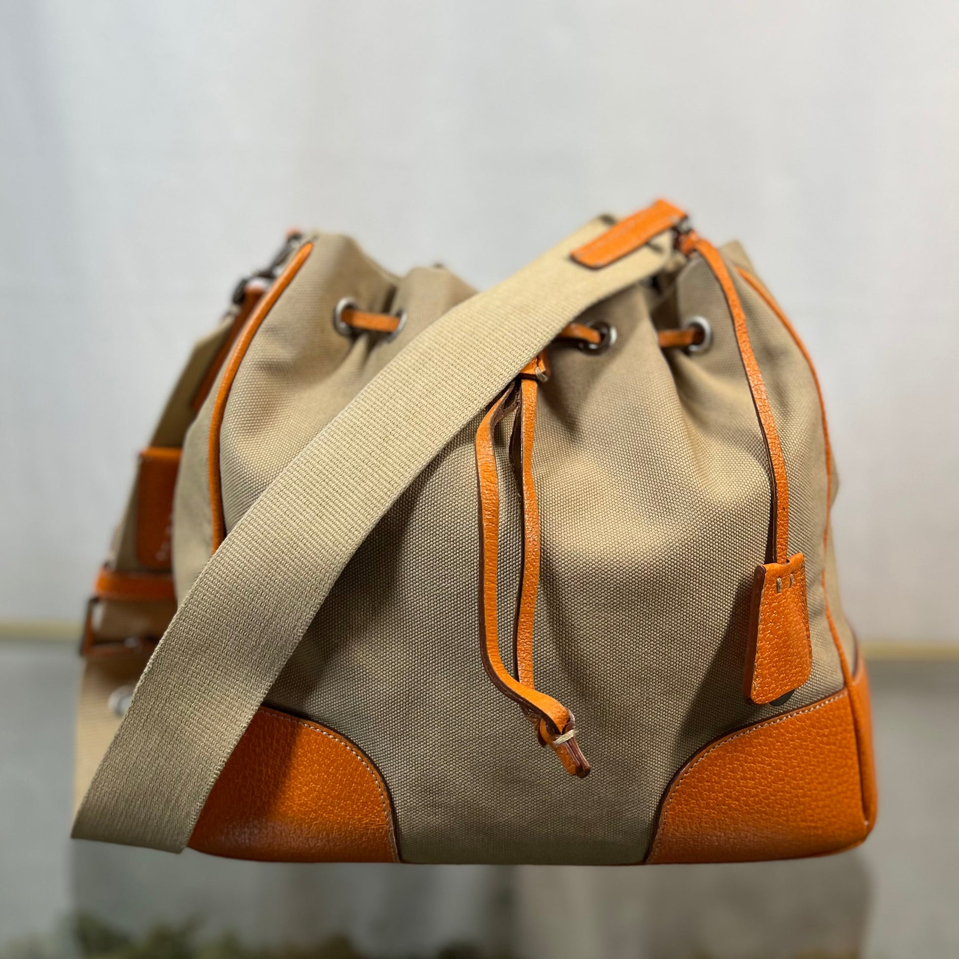 Prada Leather & Canvas Drawstring Orange Bucket Bags
