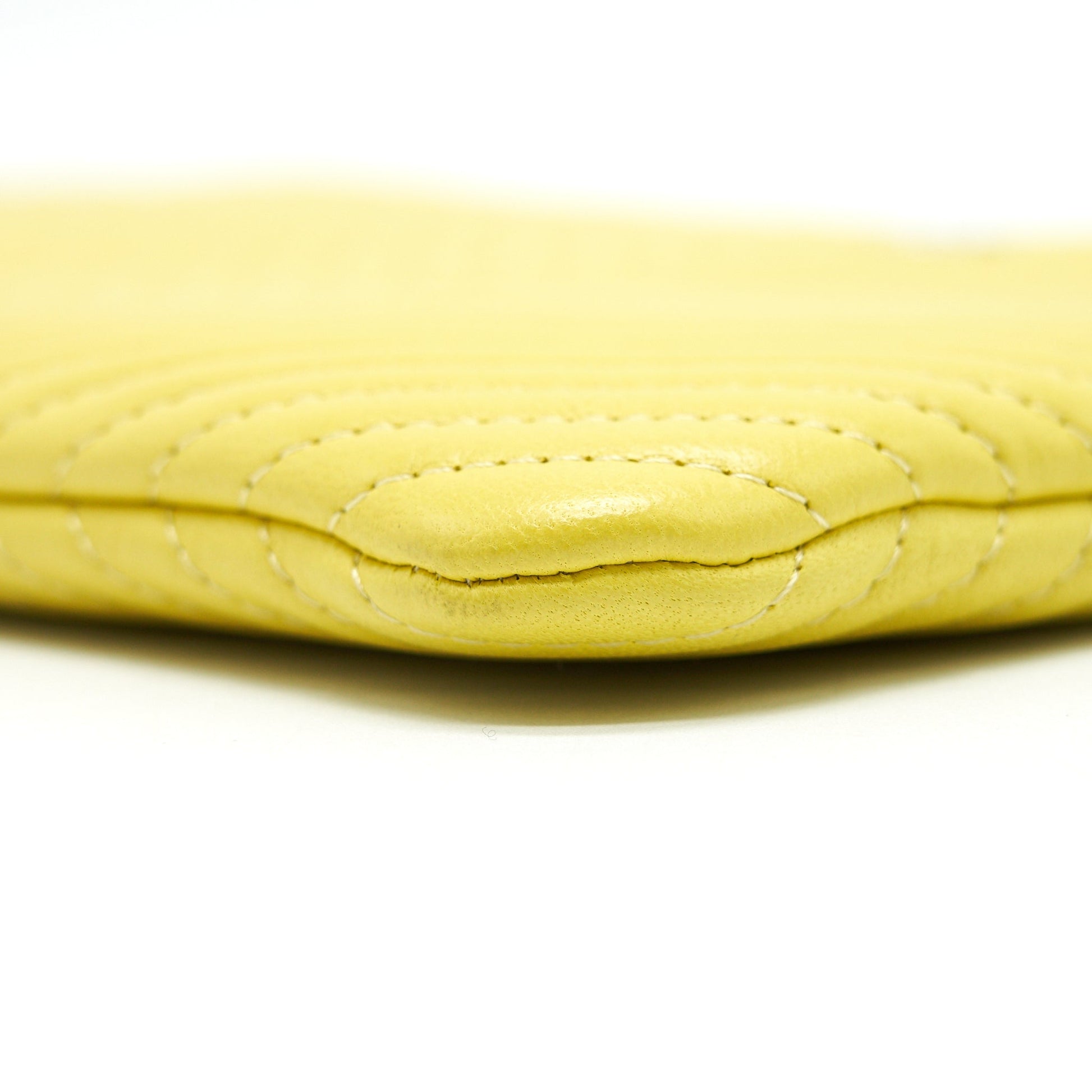 CHANEL CHEVRON CLUTCH BAG IN YELLOW