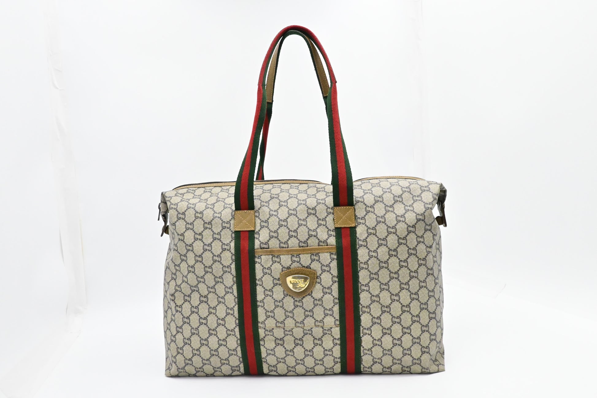 Gucci Plus Zipped Travel Bag in GG Plus Coated Canvas