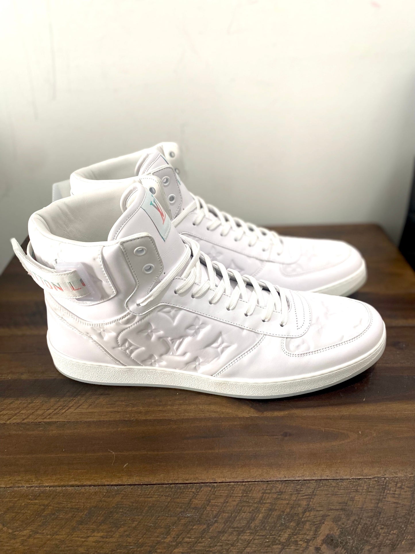 LOUIS VUITTON RIVOLI MONOGRAM LEATHER HI-TOP SNEAKERS
