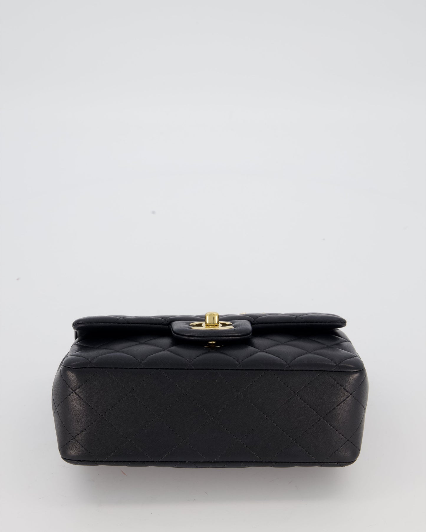 Chanel Black Mini Rectangular Top Handle Flap Bag in Lambskin Leather with Champagne Hardware and Strass Removable Bow Charm