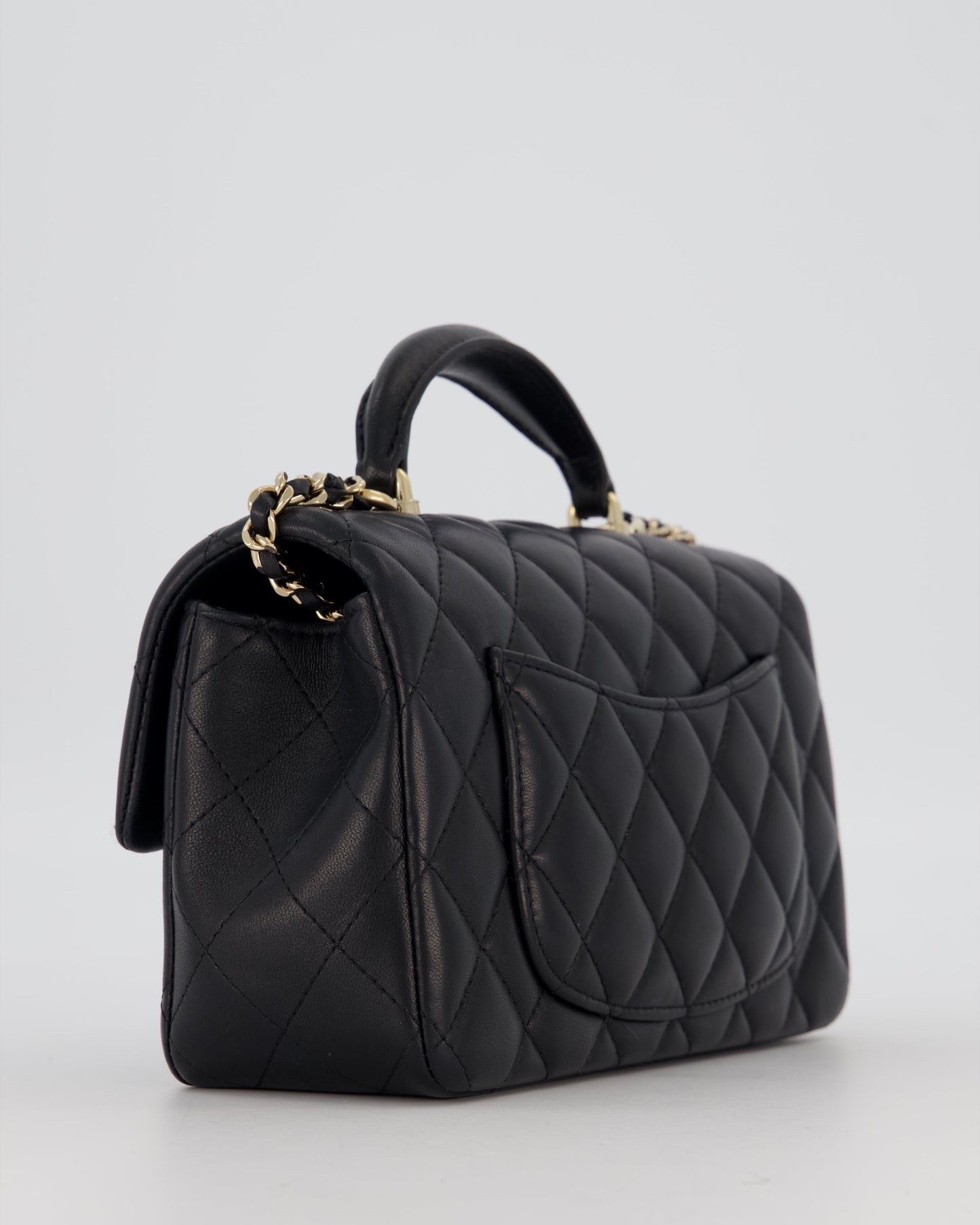 Chanel Black Mini Rectangular Top Handle Flap Bag in Lambskin Leather with Champagne Hardware and Strass Removable Bow Charm