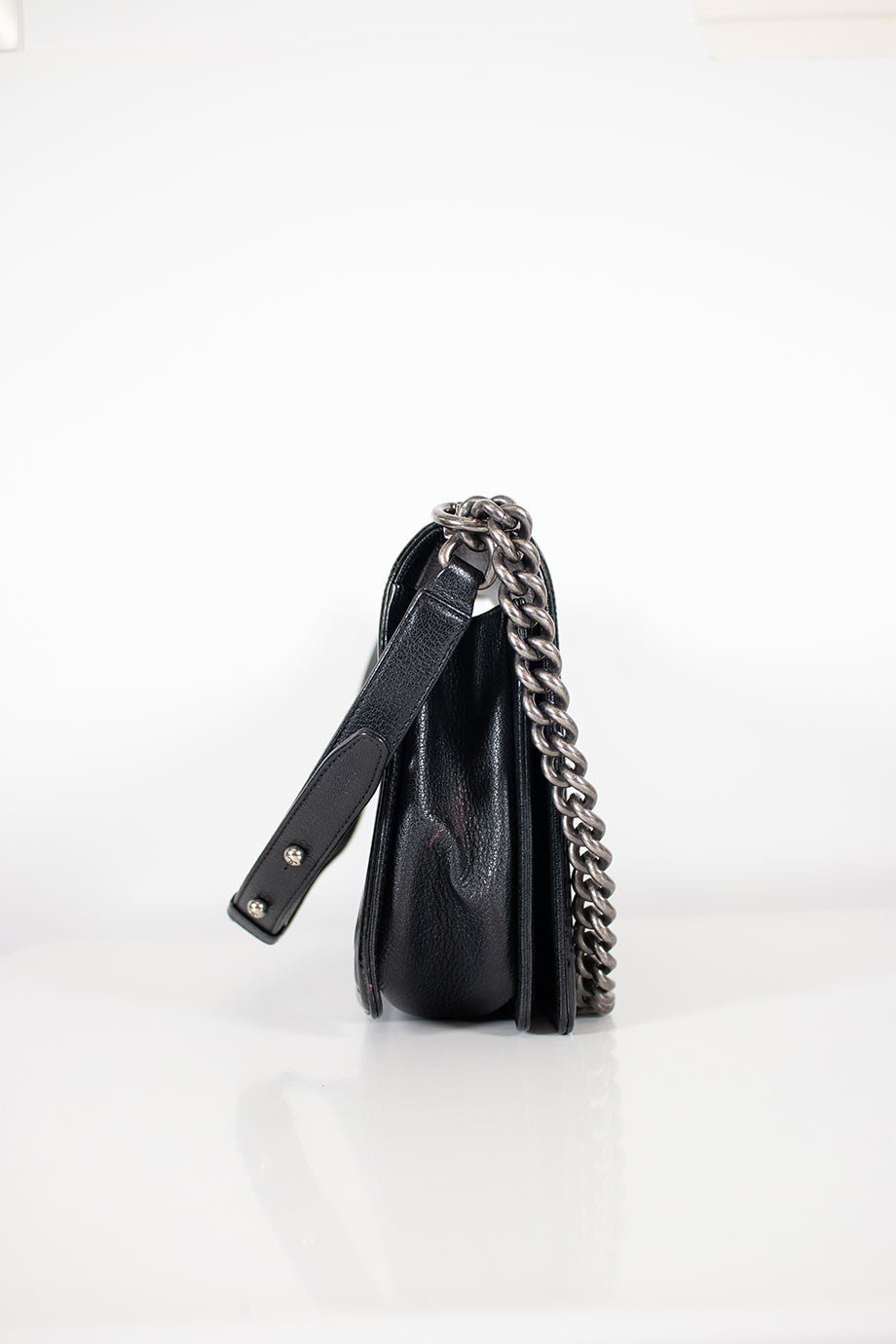 CHANEL Black grained calfskin quilted 'Boy' bag with ruthenium-finish hardware and patent border in 'New Medium' size