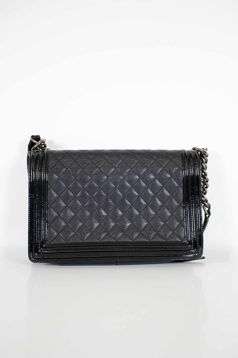 CHANEL Black grained calfskin quilted 'Boy' bag with ruthenium-finish hardware and patent border in 'New Medium' size